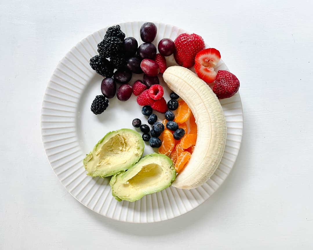 a-white-plate-topped-with-fruits-and-vegetables-u-o9dcdi4e8